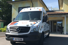 ursula-schueler-rollstuhlfahrtendienst-bus-vip-sprinter-orange-front-scaled